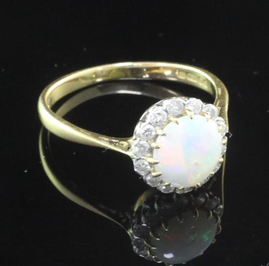 A late 1970s 18ct gold, white opal and diamond cluster ring, size T.